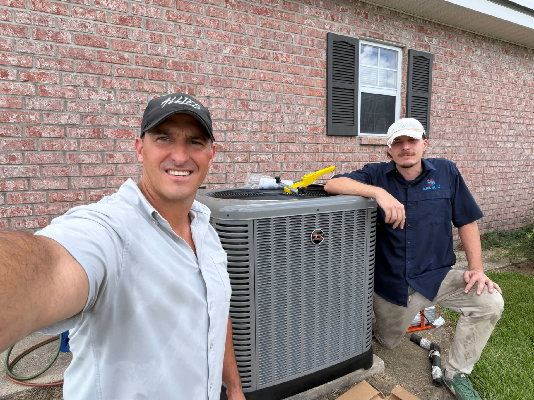 Allies Air technicians installing an AC unit